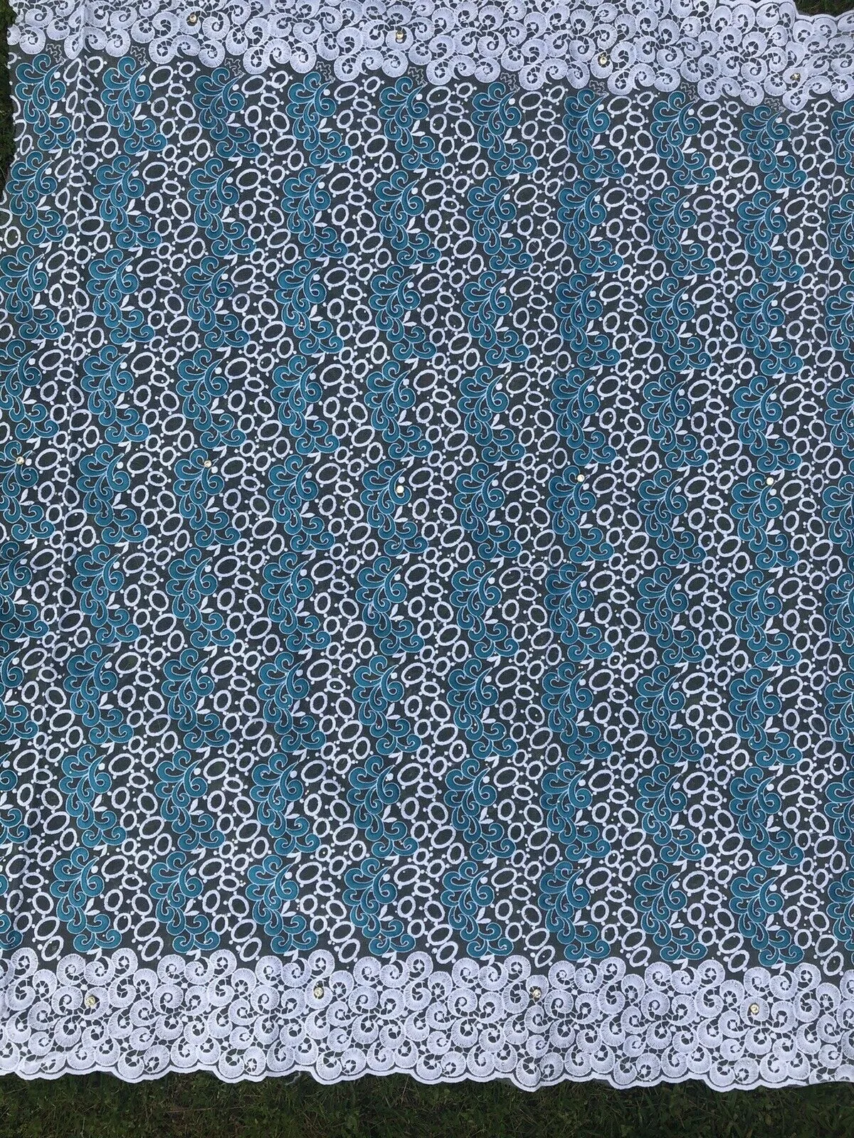 White And Teal Embroidered Lace Fabric